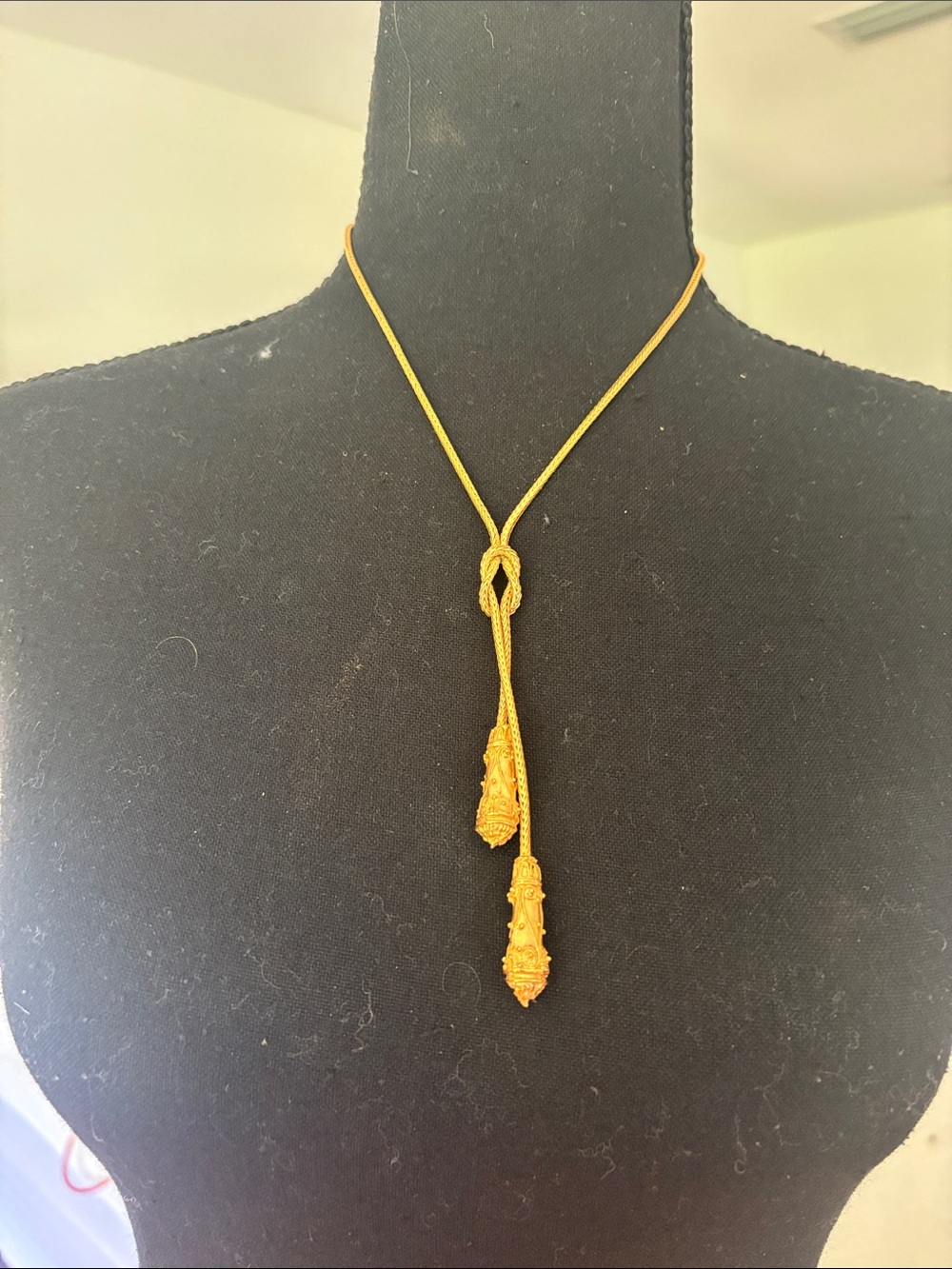 Elegant Gold-Tone Lariat Necklace with Decorative Tassel Ends